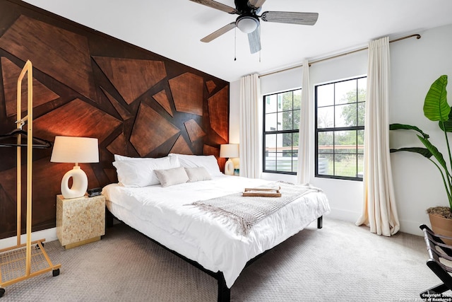 bedroom with light colored carpet and ceiling fan