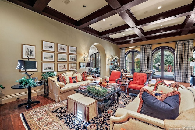 living room featuring beamed ceiling, wood-type flooring, coffered ceiling, and french doors