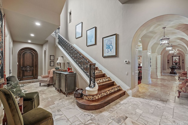 interior space with a towering ceiling and decorative columns