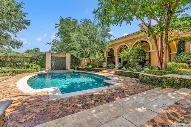 view of pool featuring a patio