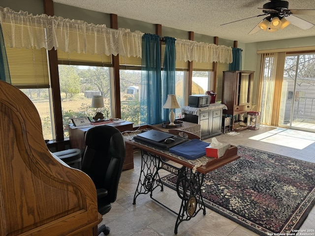 interior space with ceiling fan