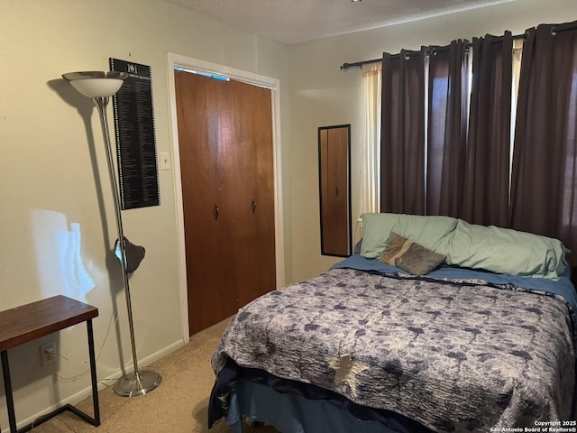 carpeted bedroom featuring a textured ceiling