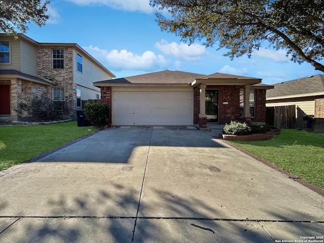 view of front of house with a garage and a front yard