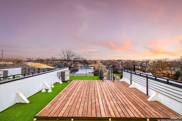 deck at dusk with a lawn