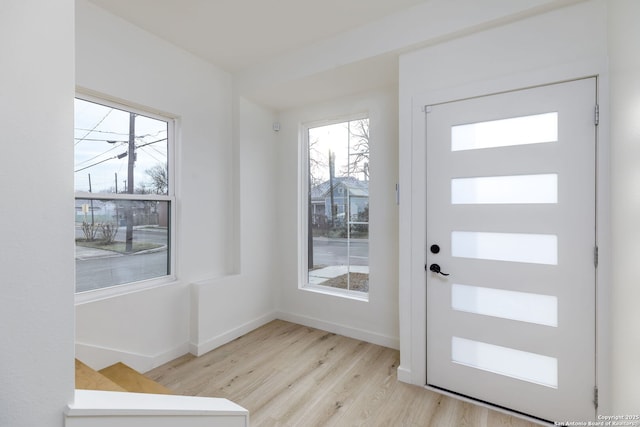 foyer with light hardwood / wood-style floors