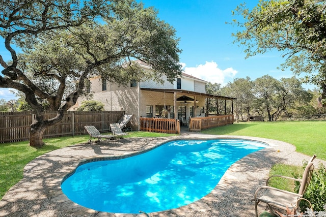 view of pool with a yard and a patio