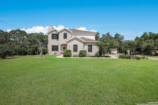 front facade featuring a front lawn