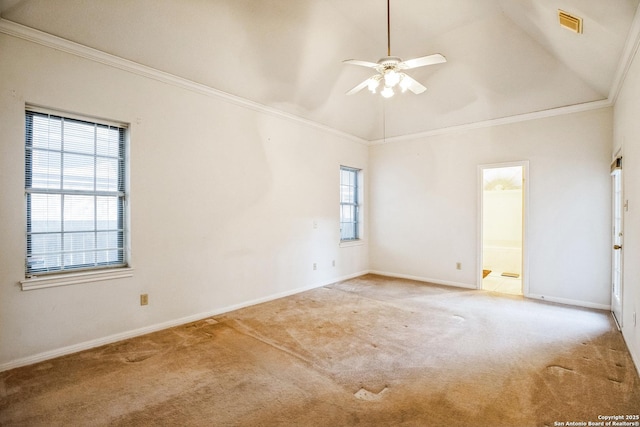 spare room with ceiling fan, ornamental molding, light carpet, and high vaulted ceiling