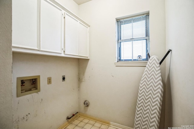 clothes washing area with gas dryer hookup, electric dryer hookup, hookup for a washing machine, and cabinets