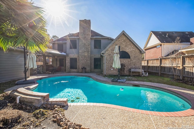 view of swimming pool with a patio