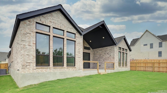 1716 Madden Hvn, San Antonio, TX 78245 - rear view of house with central AC unit and brick siding