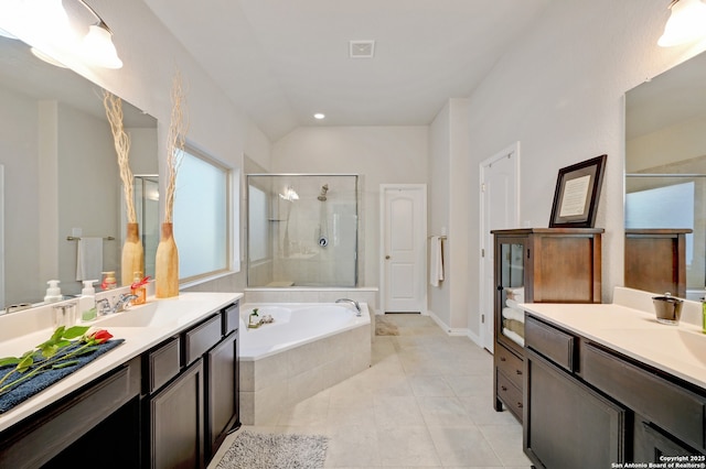 bathroom featuring vanity, independent shower and bath, and tile patterned flooring