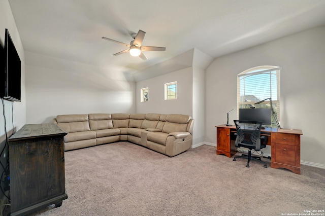 living room with a wealth of natural light, light colored carpet, and ceiling fan