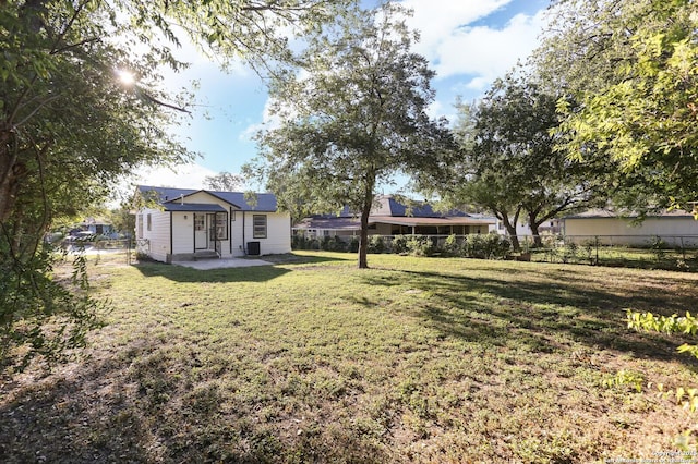 view of yard featuring a patio and central AC unit