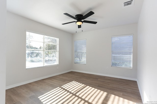 empty room with ceiling fan and wood-type flooring