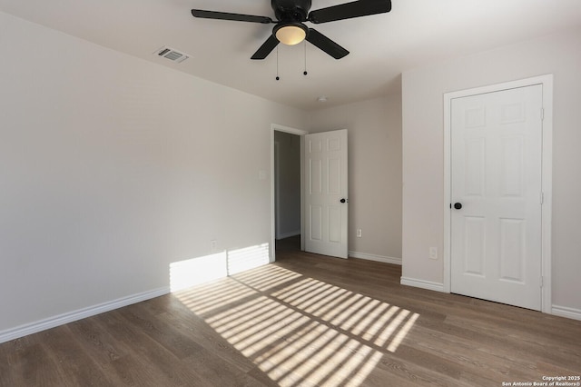 unfurnished bedroom with wood-type flooring and ceiling fan