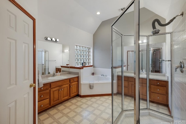 bathroom featuring lofted ceiling, vanity, and plus walk in shower