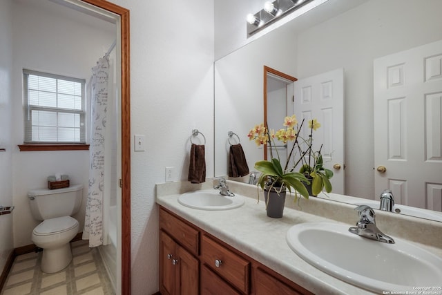 full bathroom featuring vanity, toilet, and shower / tub combo