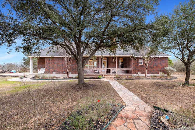 ranch-style house featuring a porch