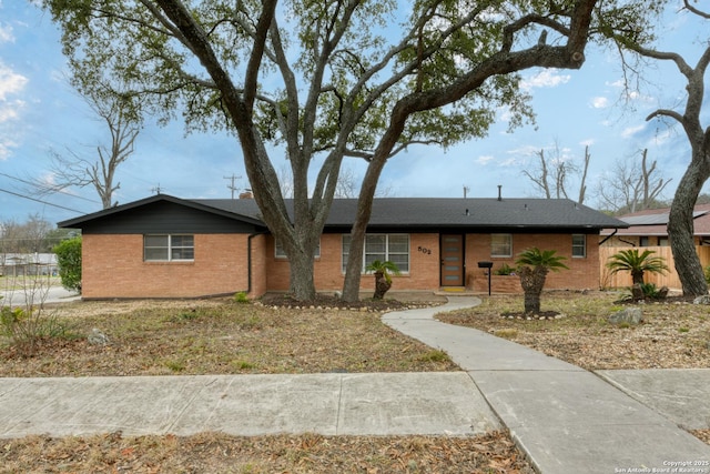 single story home with brick siding