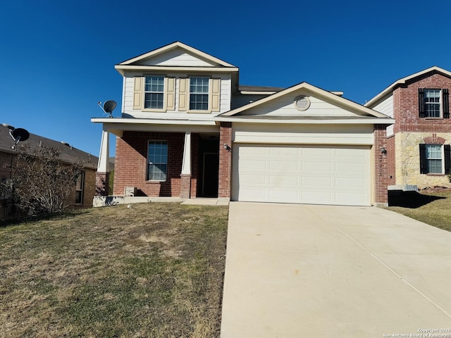 view of property with a garage and a front lawn