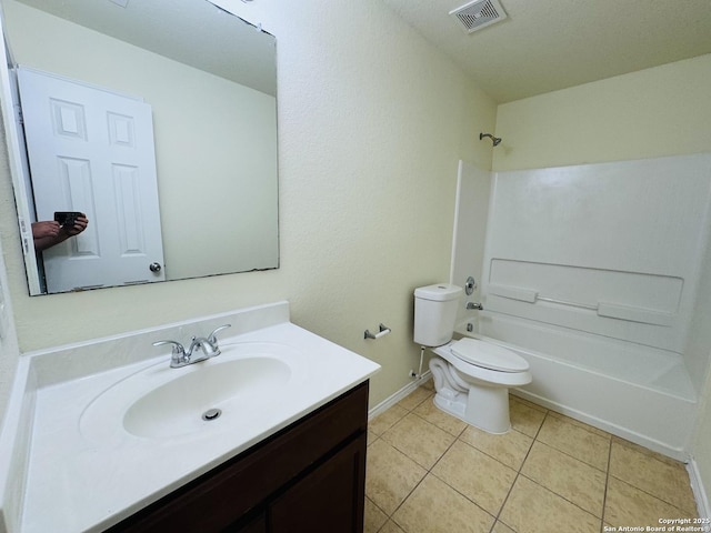 full bathroom featuring vanity, toilet, tile patterned flooring, and shower / bathing tub combination