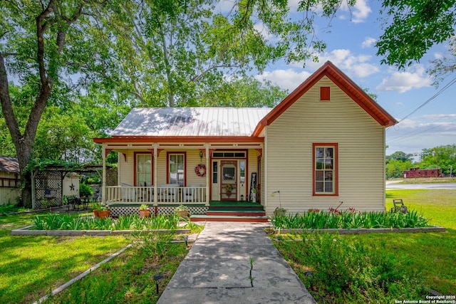 bungalow-style home featuring a porch and a front lawn