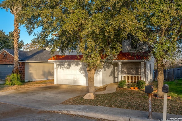 view of front of property featuring a garage and covered porch