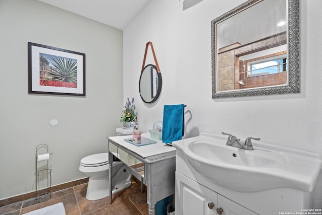 bathroom with vanity, tile patterned flooring, and toilet