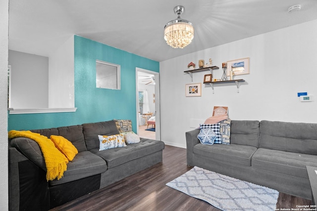 living room featuring dark hardwood / wood-style floors and a chandelier