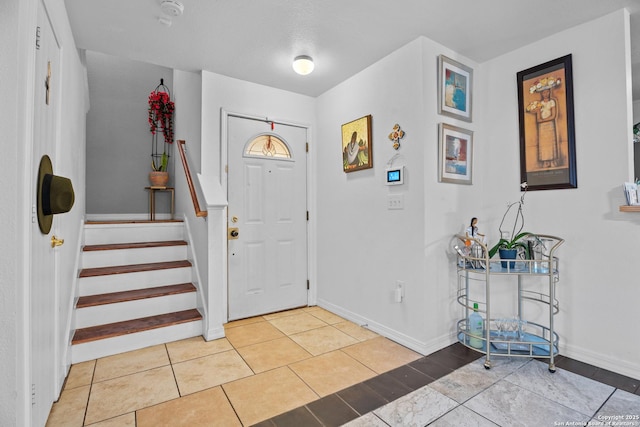 entrance foyer featuring light tile patterned flooring