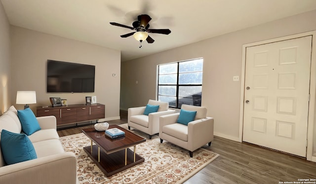 living room featuring hardwood / wood-style flooring and ceiling fan