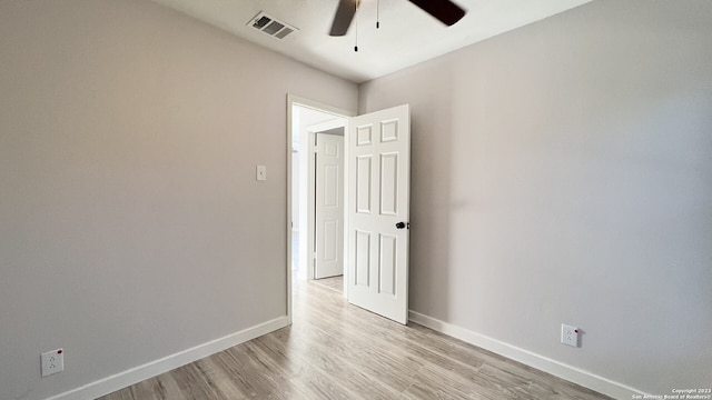 unfurnished room with ceiling fan and light hardwood / wood-style flooring