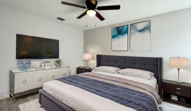 bedroom with wood-type flooring and ceiling fan