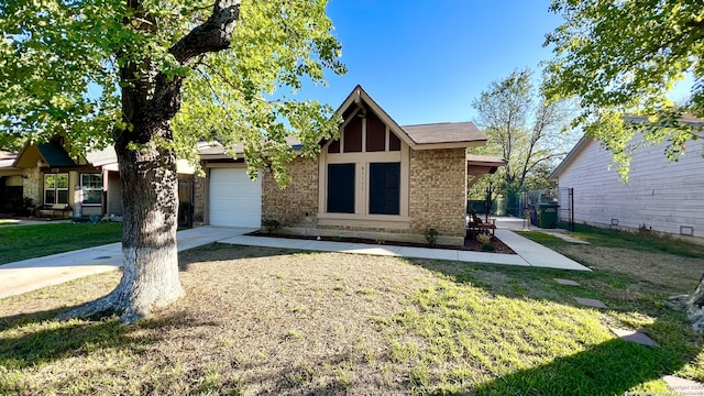 view of front of home with a garage and a front yard