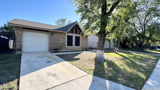 view of front of property with a garage and a front yard