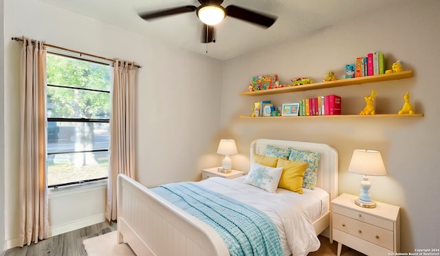 bedroom with hardwood / wood-style flooring and ceiling fan