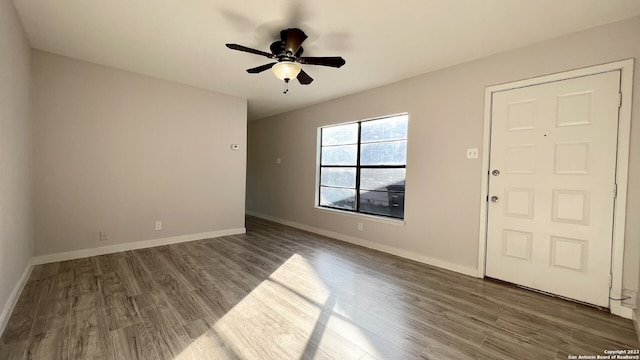 foyer with hardwood / wood-style floors and ceiling fan