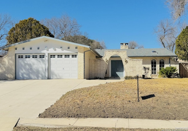 ranch-style home featuring a garage