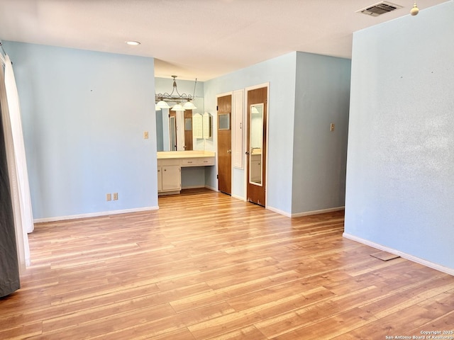 empty room with light wood-type flooring