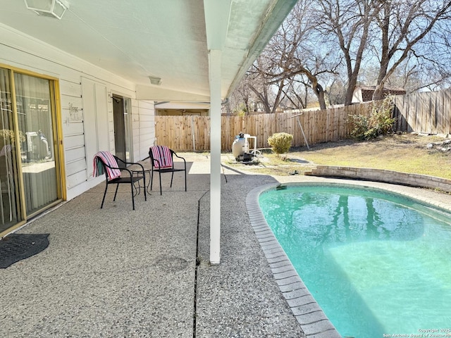 view of swimming pool with a patio area