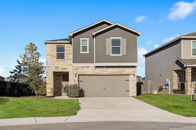 view of front of property with a garage and a front lawn