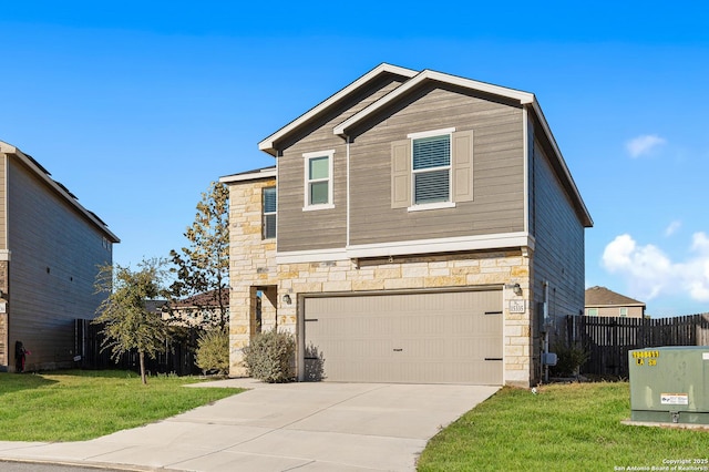 view of front of home with a garage and a front lawn