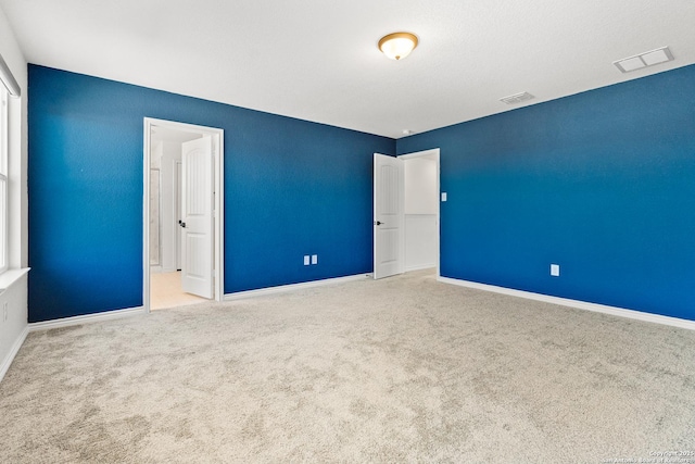 spare room featuring carpet floors