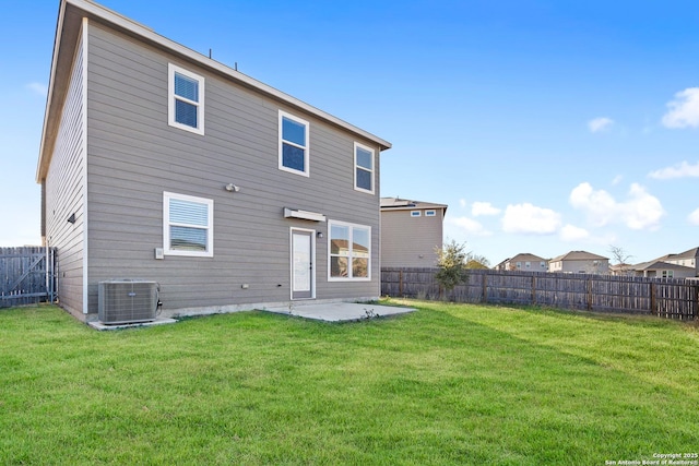 back of house with cooling unit, a patio, and a lawn