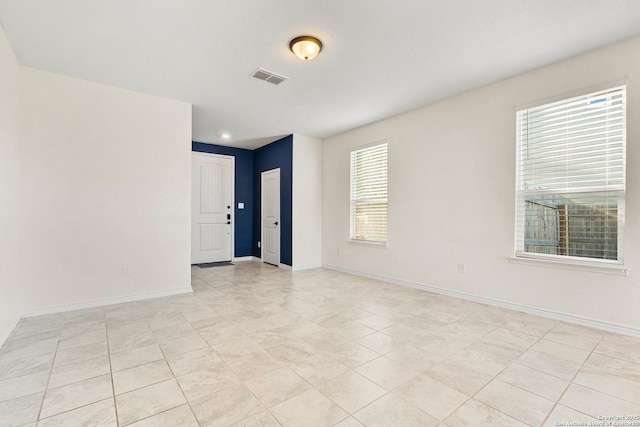 spare room with light tile patterned flooring