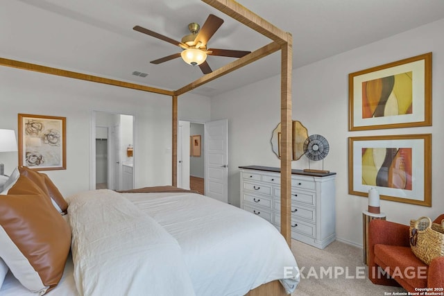 carpeted bedroom with ceiling fan and connected bathroom