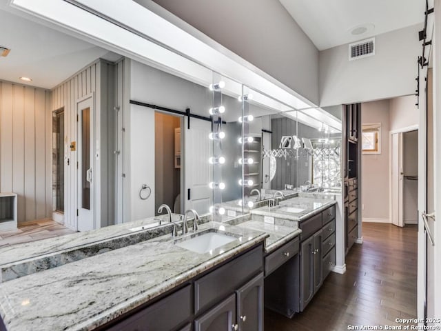 bathroom featuring vanity and hardwood / wood-style floors