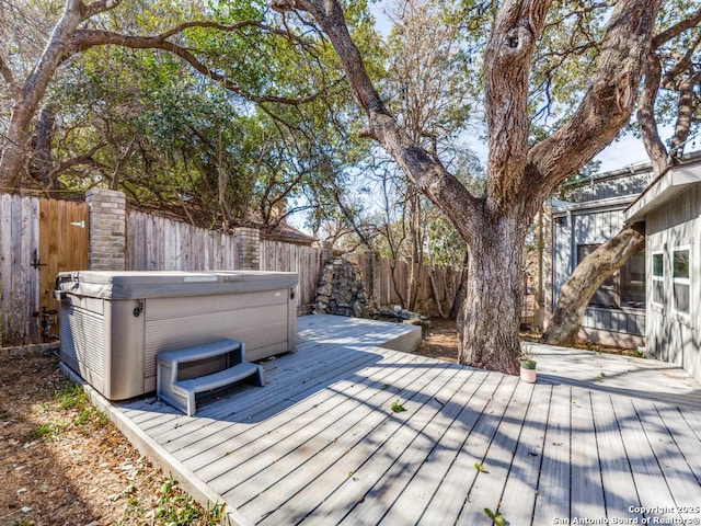 deck featuring a hot tub