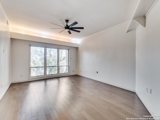 spare room with ceiling fan and light hardwood / wood-style flooring